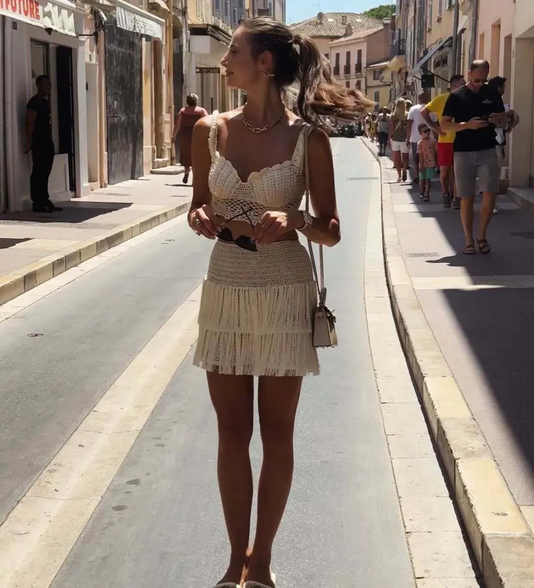 Elegant Summer Tassel-Trimmed Crochet Top and Flirty Mini Skirt Two-Piece Set