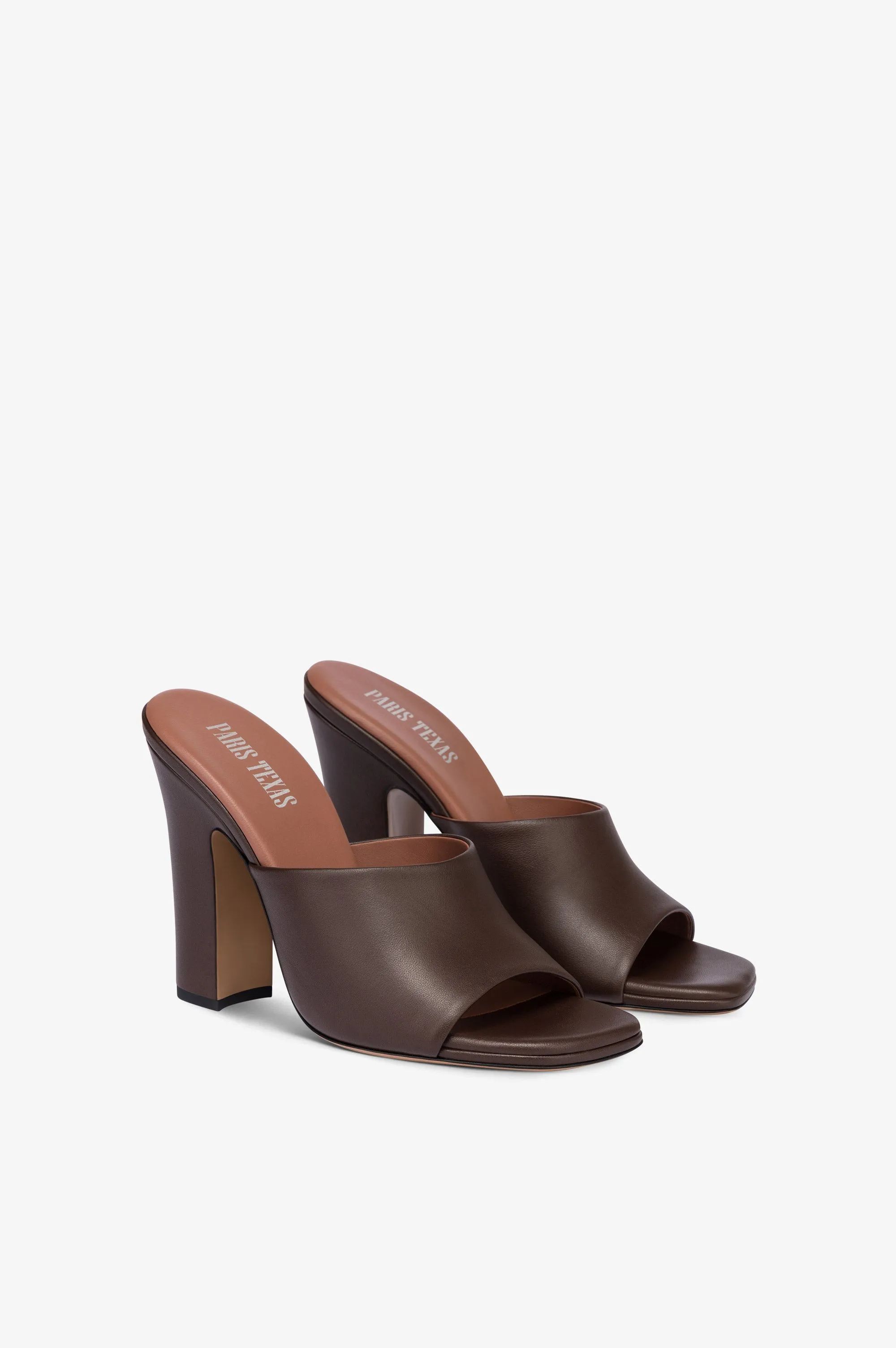 Mules in ebony leather