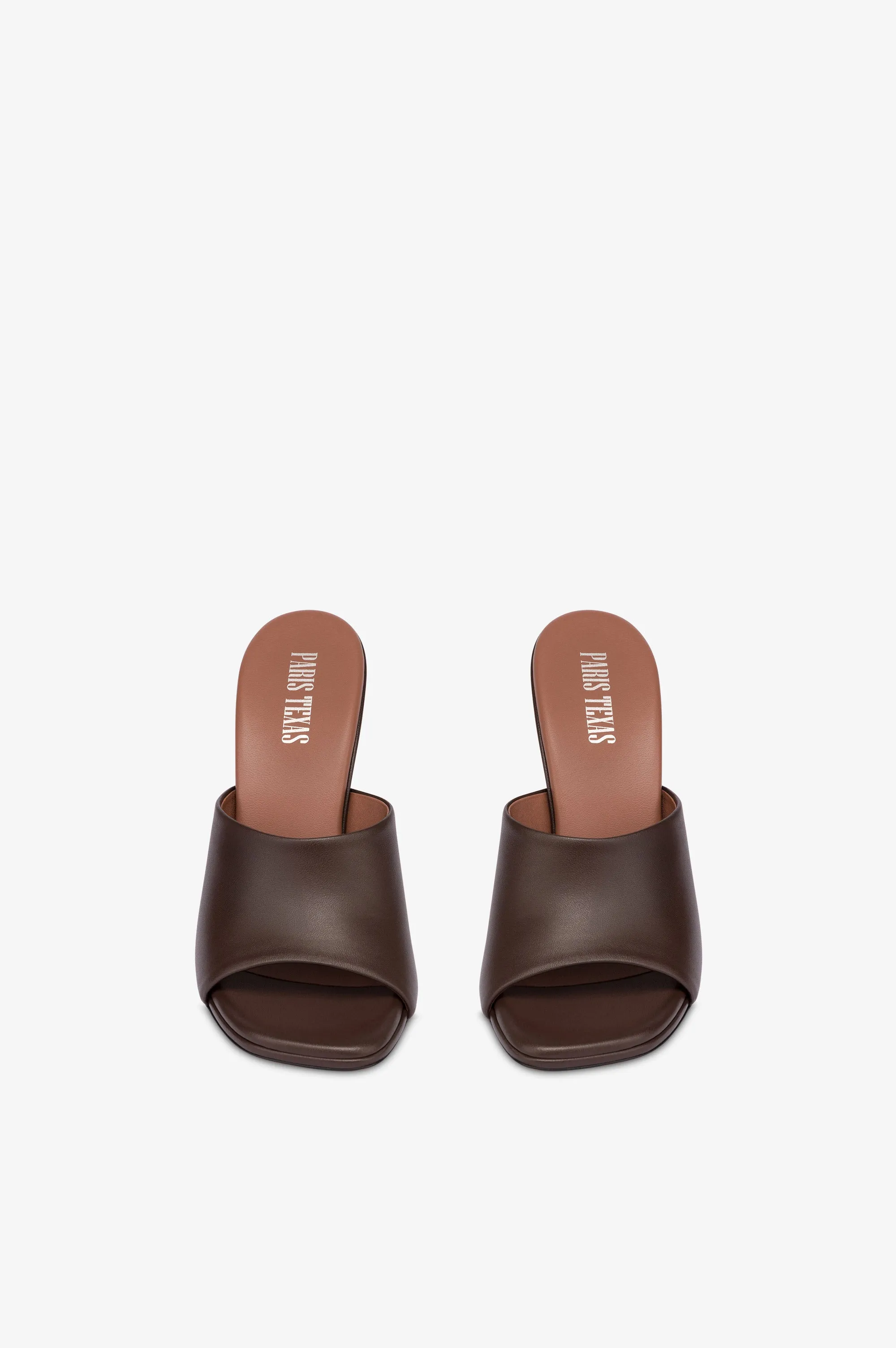 Mules in ebony leather
