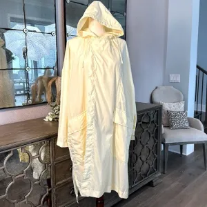 Uniqlo U packable yellow over sized hooded rain poncho.