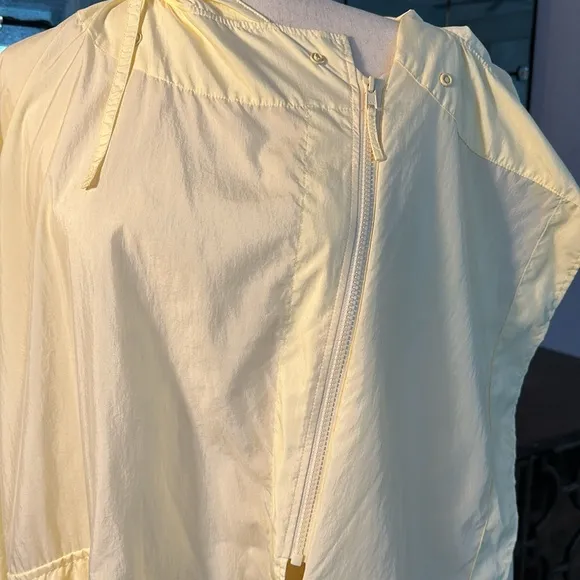 Uniqlo U packable yellow over sized hooded rain poncho.