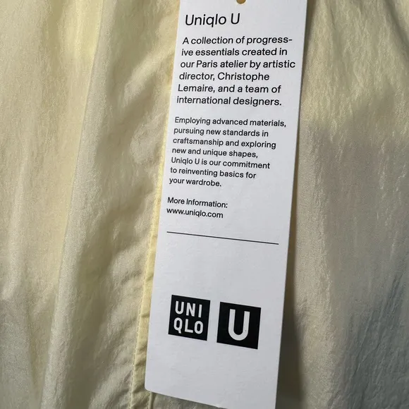 Uniqlo U packable yellow over sized hooded rain poncho.