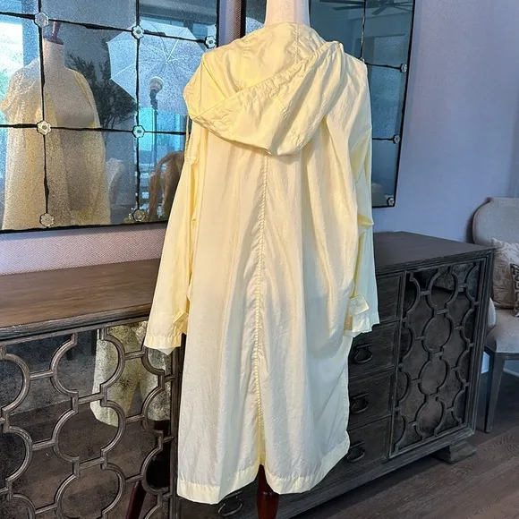 Uniqlo U packable yellow over sized hooded rain poncho.