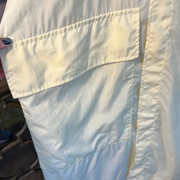 Uniqlo U packable yellow over sized hooded rain poncho.
